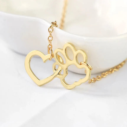 Halsketting met hondenpoot en hart hanger | Dierenliefde sieraad voor dames | Goud en zilver | Voor honden- en kattenliefhebbers | 42+7cm ketting | Trendy accessoire