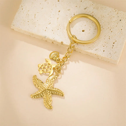 Sleutelhanger oceaan thema | Schildpad, zeester & schelp hanger | RVS | Trendy sleutelhanger voor tas, rugzak of sleutelbos | Zomercadeau strandliefhebber