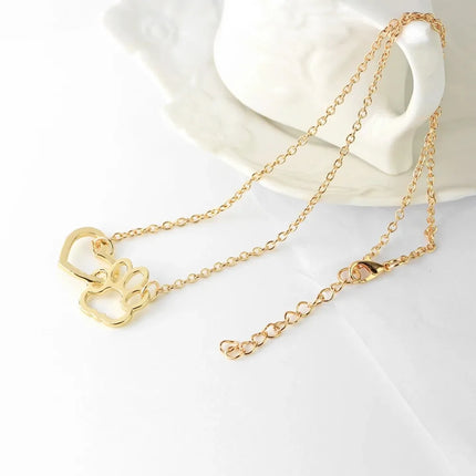 Halsketting met hondenpoot en hart hanger | Dierenliefde sieraad voor dames | Goud en zilver | Voor honden- en kattenliefhebbers | 42+7cm ketting | Trendy accessoire